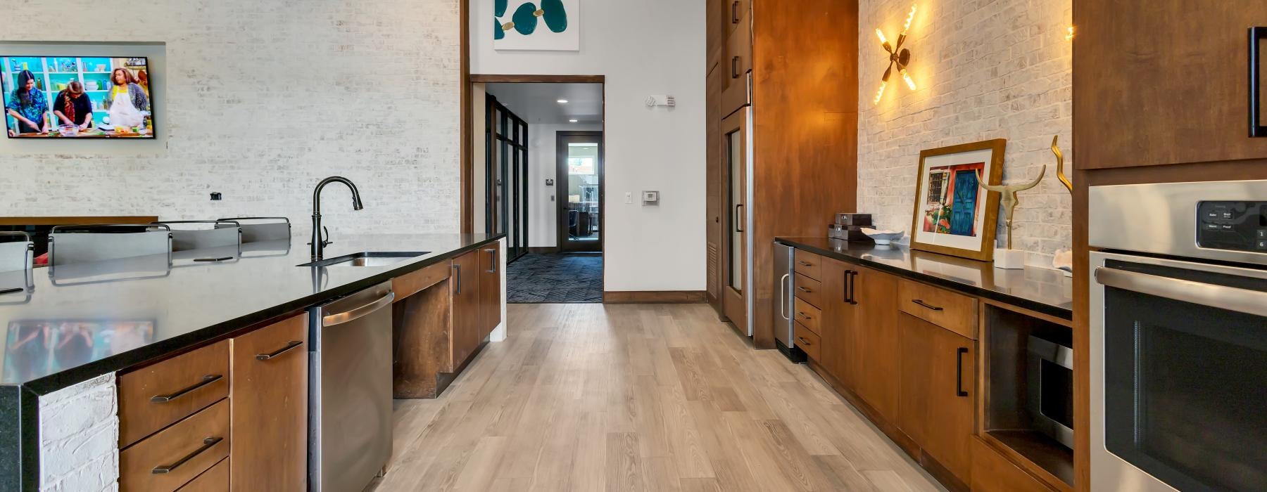 a kitchen with wooden cabinets
