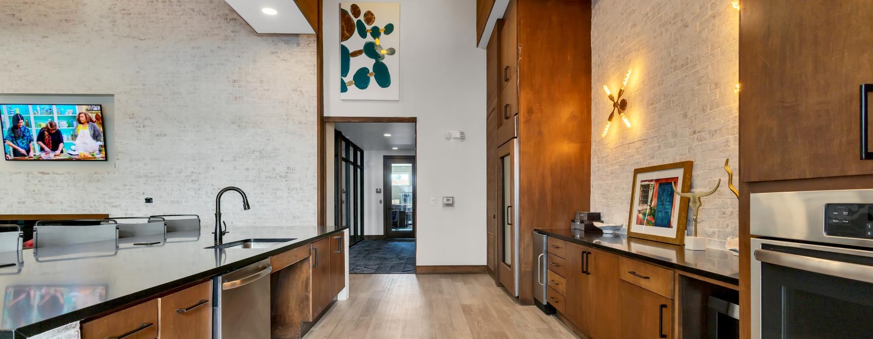 a kitchen with wooden cabinets