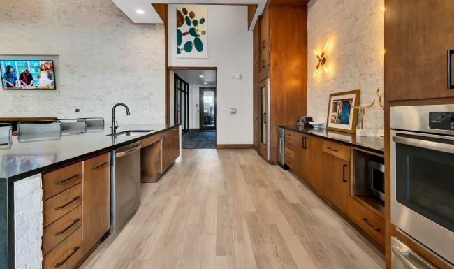a kitchen with wooden cabinets